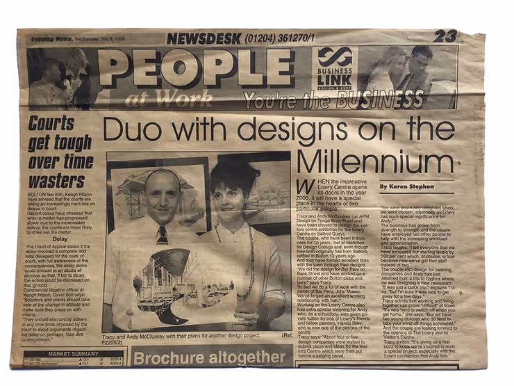Photo of Newspaper with headline "Duo with designs on the Millenium"