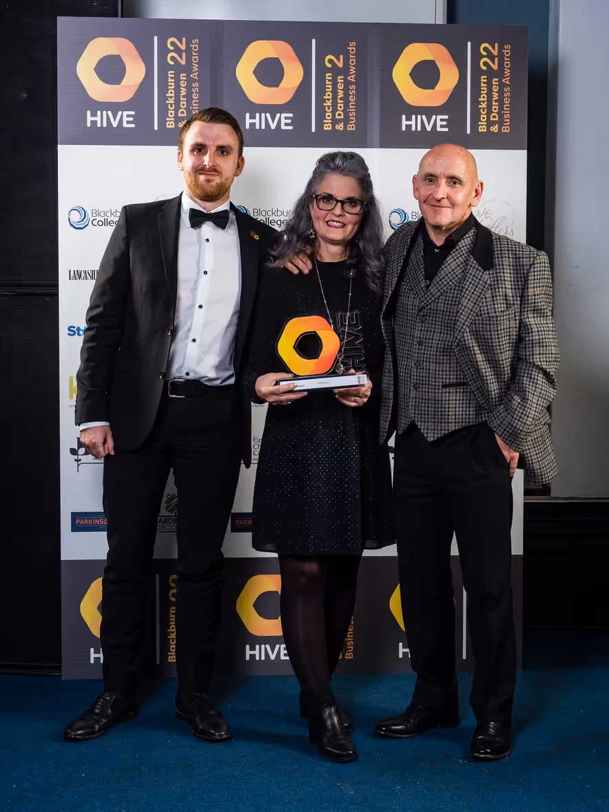 Image of the APM Design team attending the Hive Blackburn & Darwen Business Awards 22 celebrating their Creative and Digital Business Award win