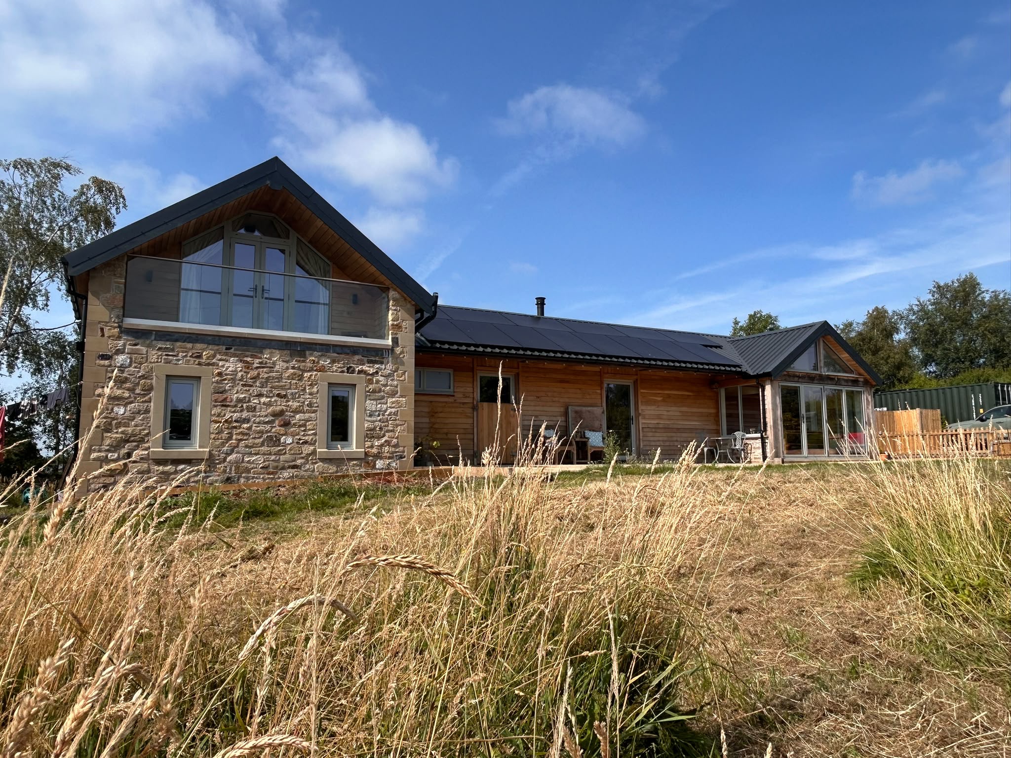 Off grid Lancashire Stable conversion home, oak cladding with stone