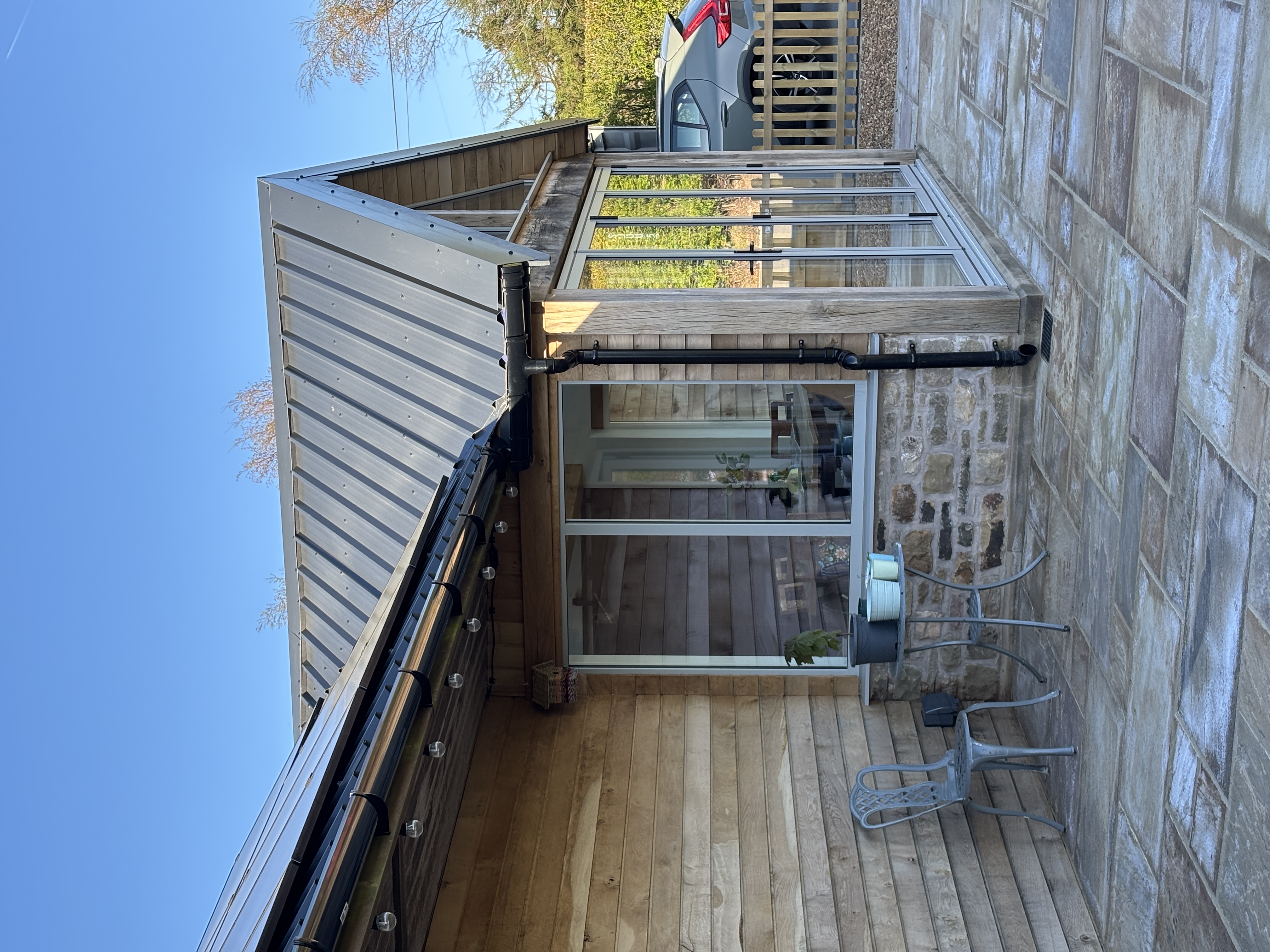 Stable conversion project, oak clad with matching indian paving.
