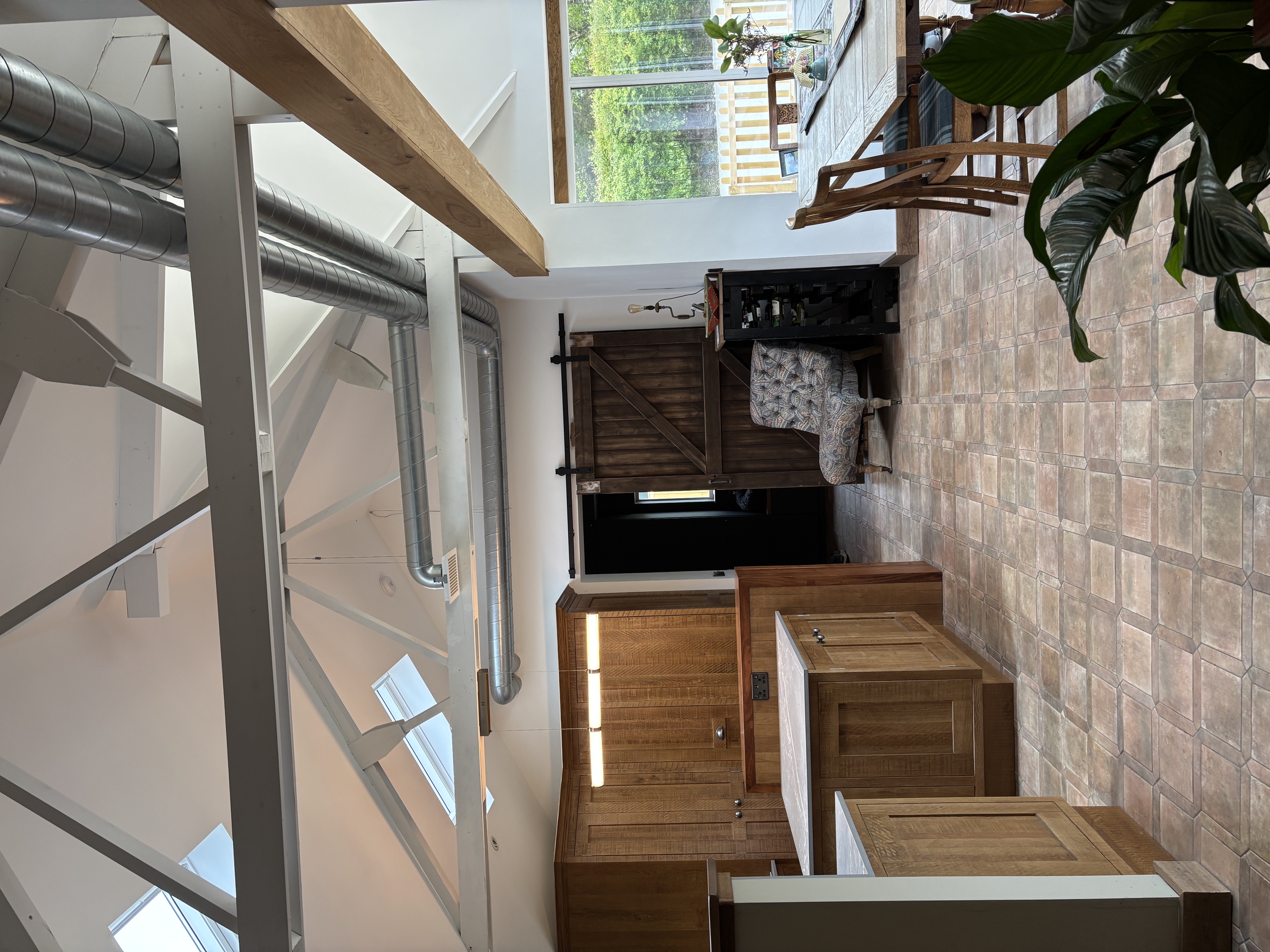 Exposed MVHR with vaulted ceilings and exposed timber structure.