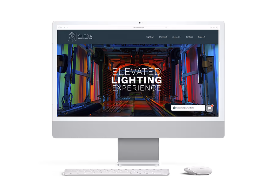 The homepage for Sutra Innovations, an industrial and car-wash lighting company. The background is of a multi-colored rainbow filled car wash tunnel at night. It says "elevated lighting experience".