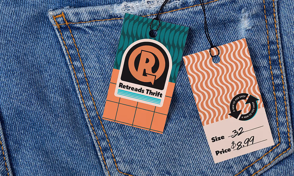 A pair of jeans with a price tag branded for Retreads Thrift by Hope is Alive. It reads Size: 32, Price: $8.99