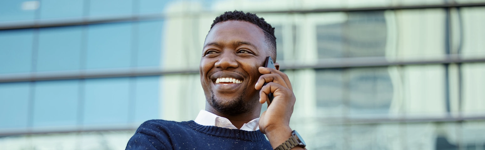 Middle aged man smiling on the phone