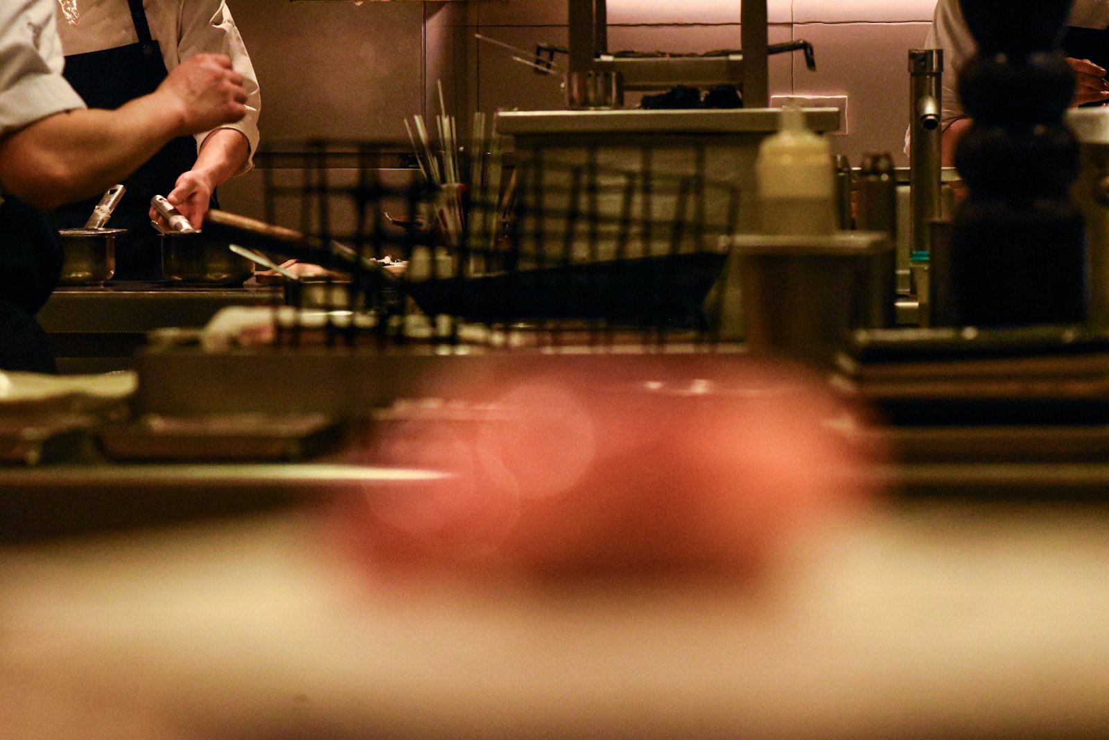 Cooks working the line in a busy commercial kitchen