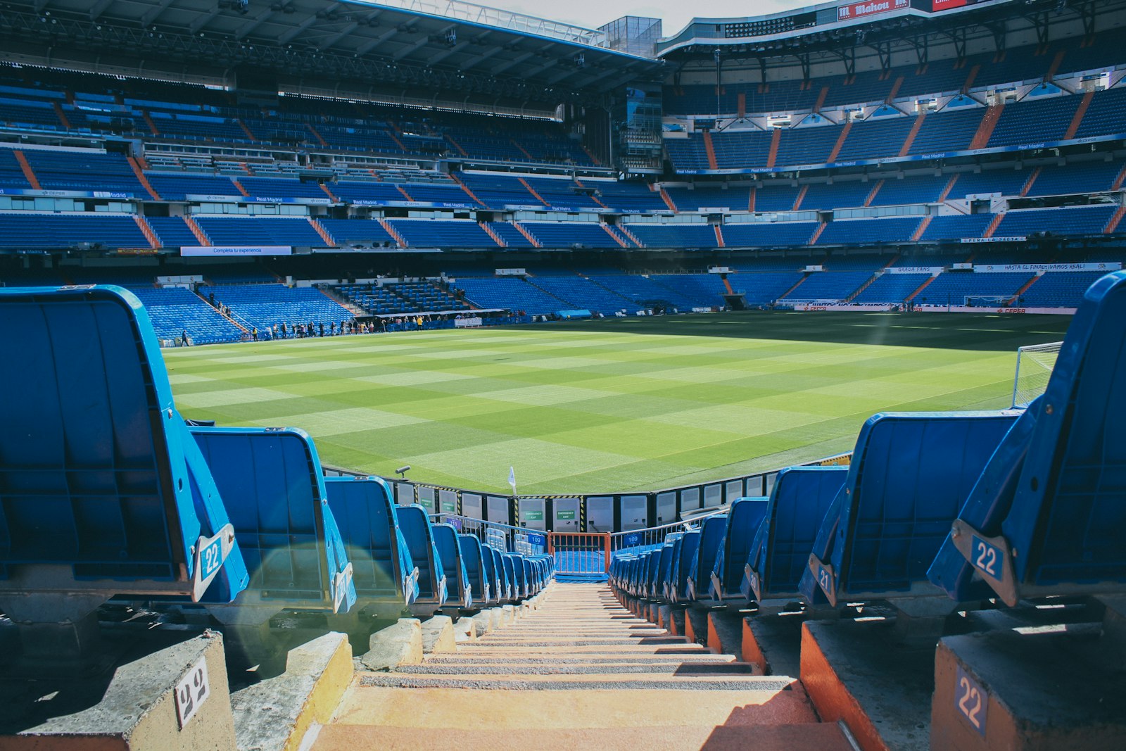 Wide interior view of a large stadium with tiered seating