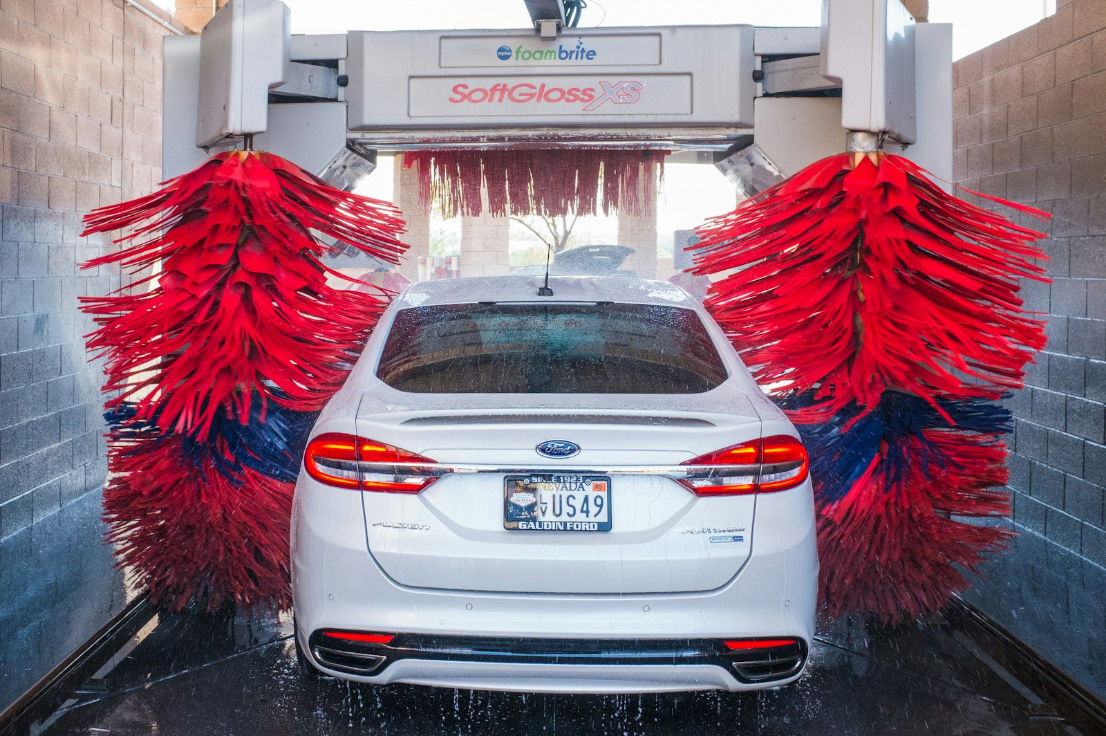 Car going through an automatic car wash tunnel