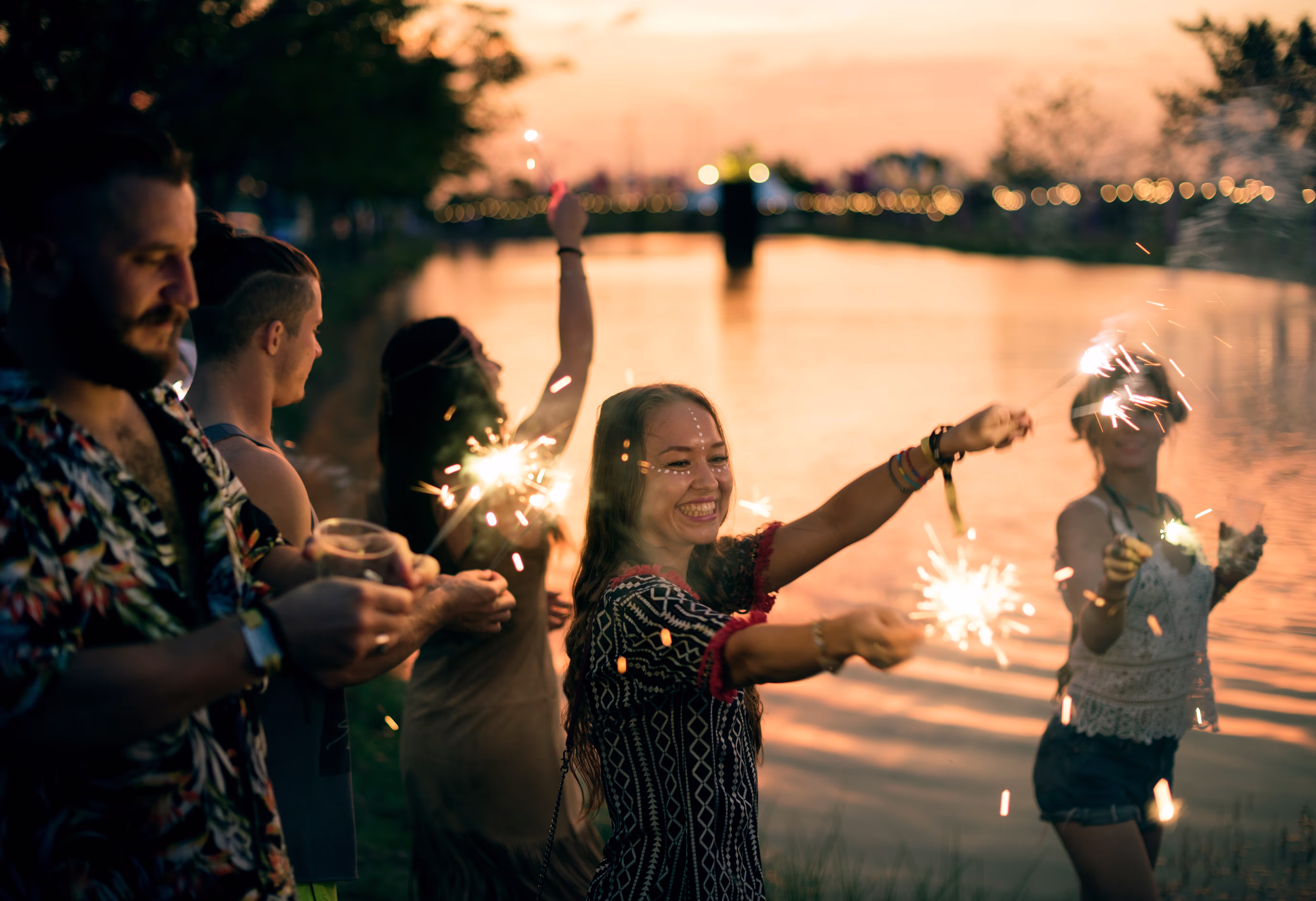 people celebrating with sparklers