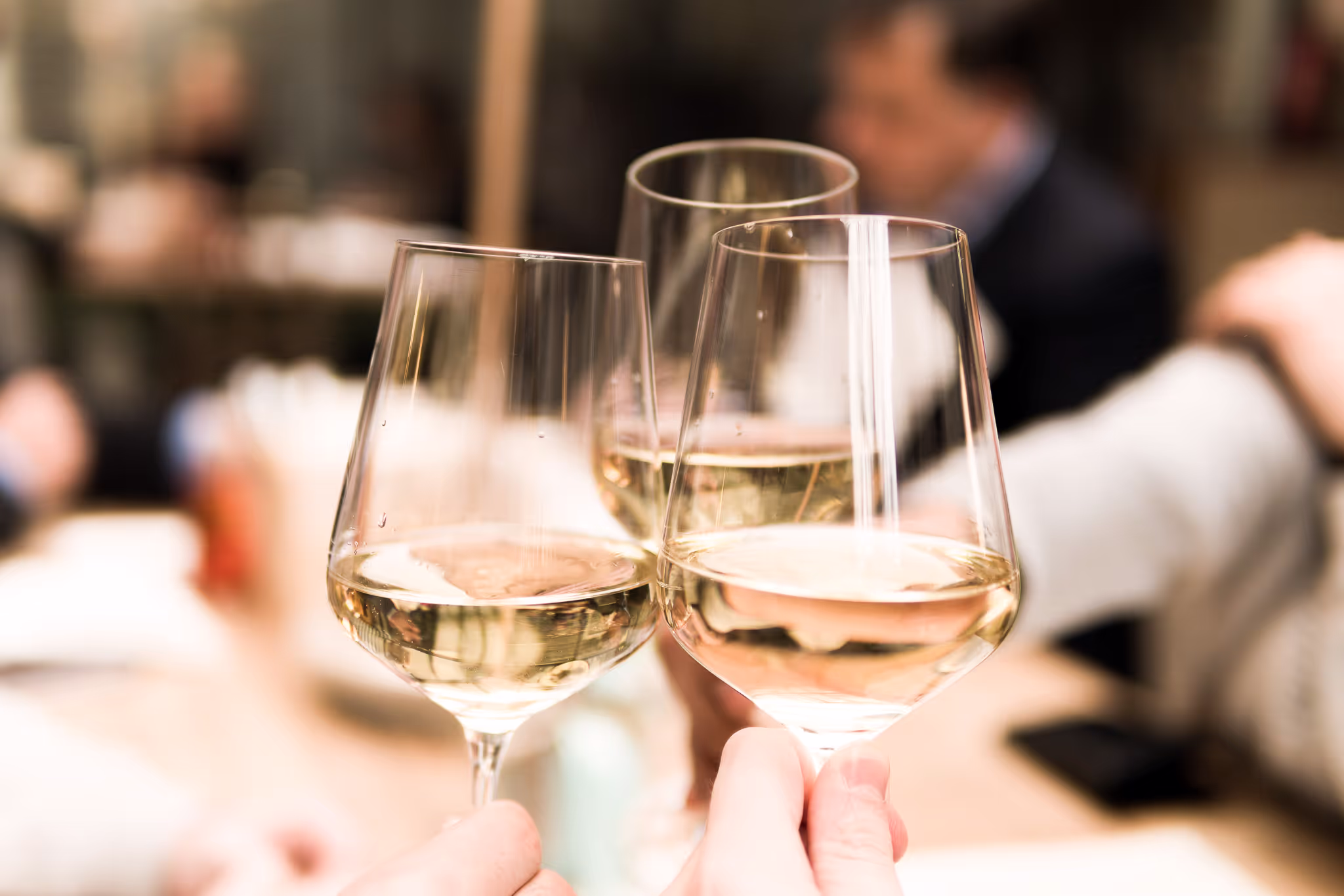 wine glasses clinking together