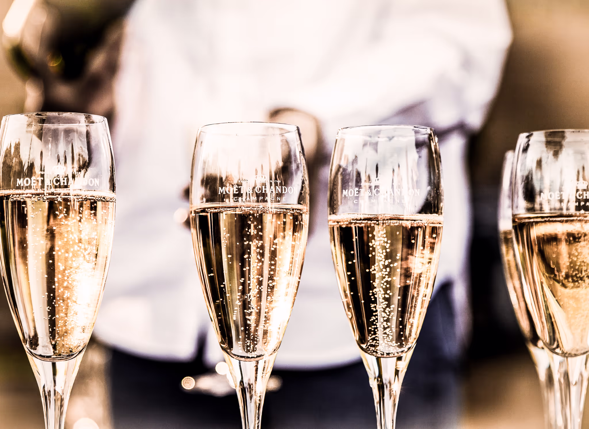 4 champagne glasses lined up