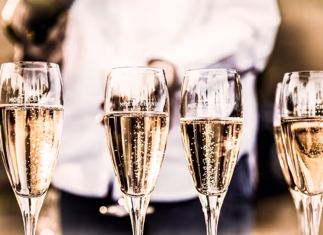 4 champagne glasses lined up