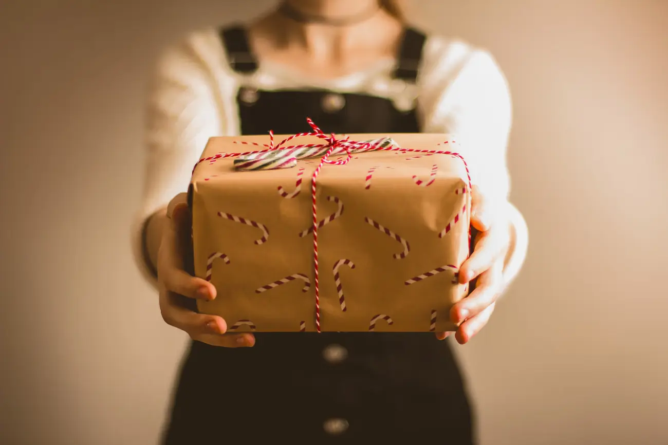 woman holding a holiday gift