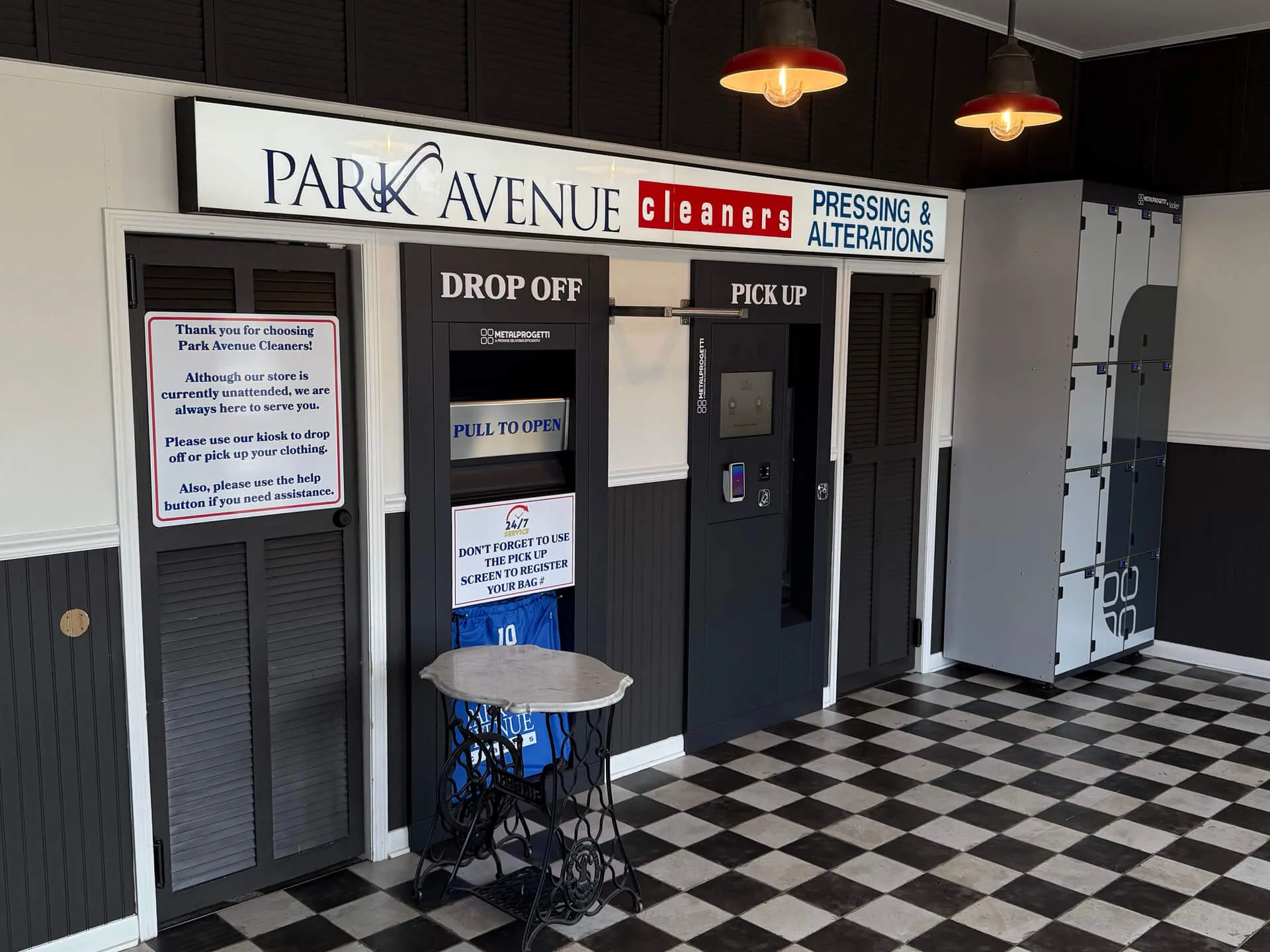 Interior of Park Avenue Cleaners kiosk with drop-off, pick-up stations, lockers, and a checkered floor.