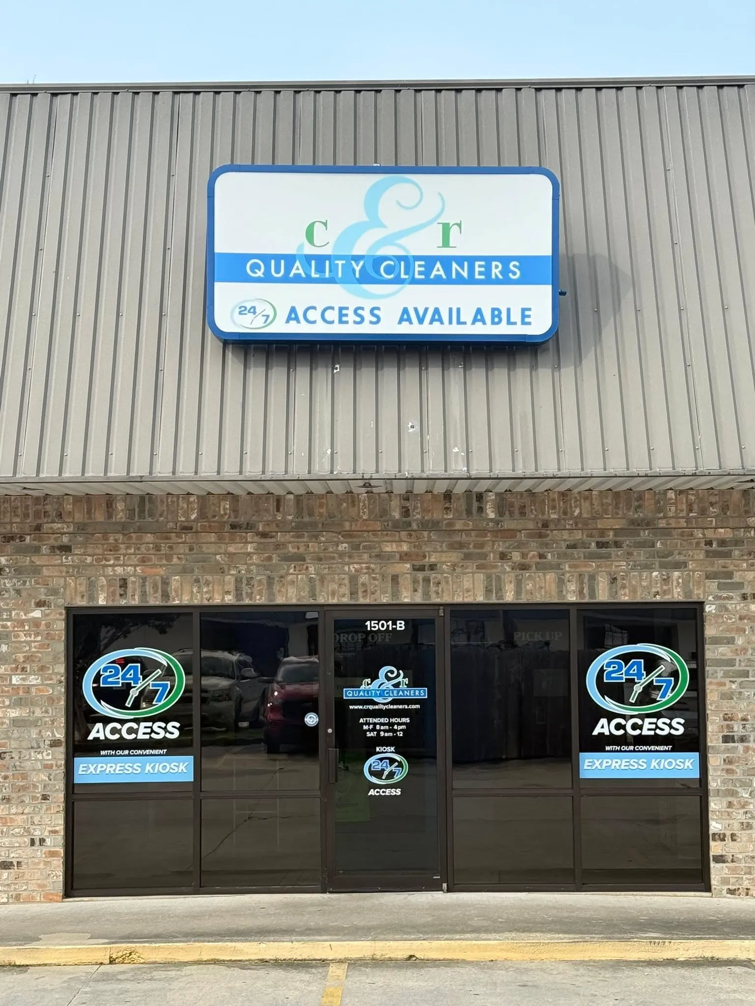 Storefront of C&R Quality Cleaners with 24/7 access signs and express kiosk availability.