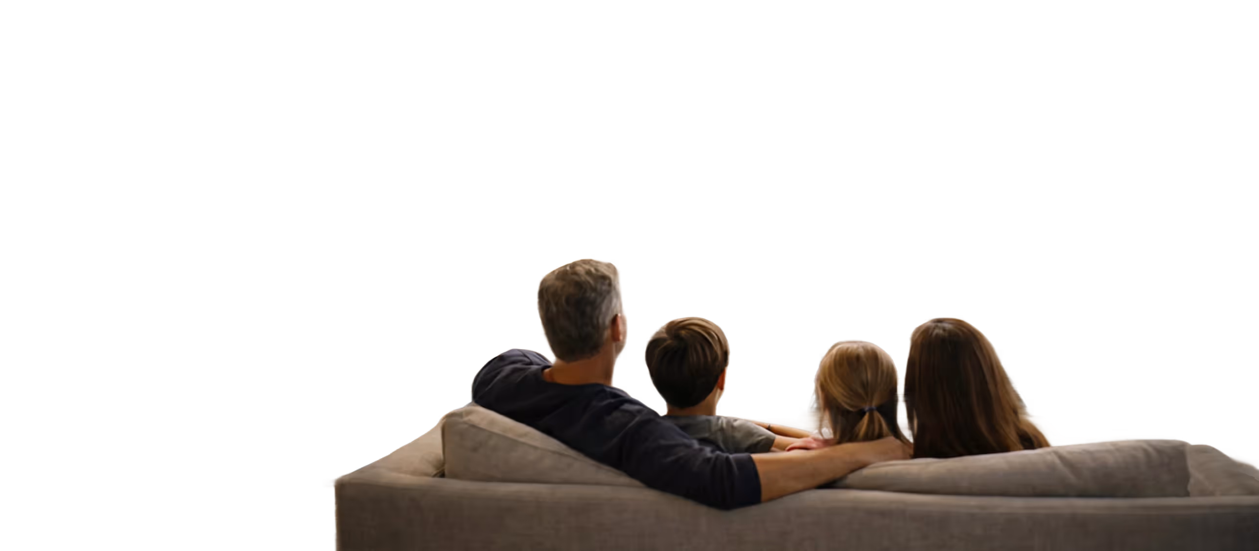 Rear view of a family of four sitting closely together on a beige couch.
