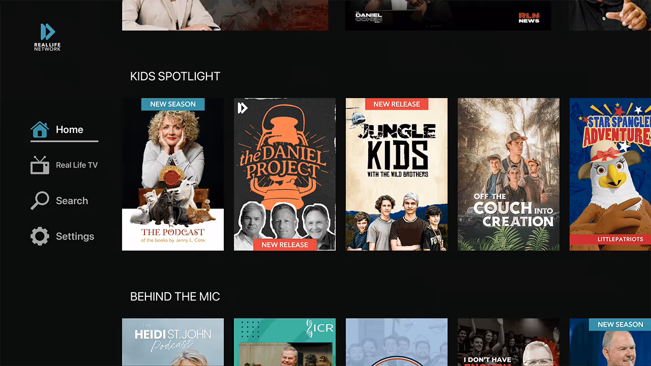Streaming interface showing Kids Spotlight section with shows like The Podcast, The Daniel Project, Jungle Kids With The Wild Brothers, Off the Couch Into Creation, and Star Spangled Adventures.
