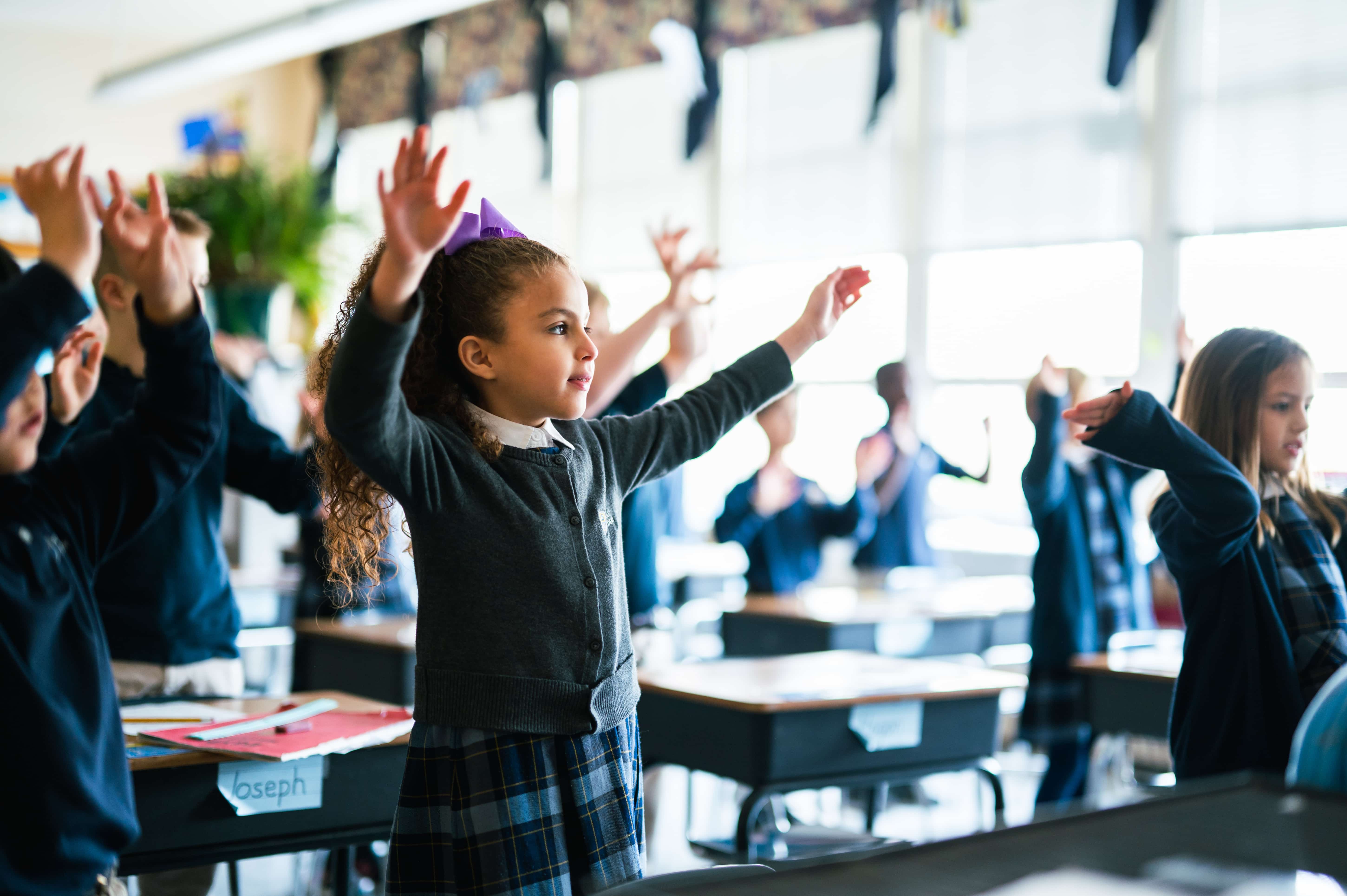 students standing in a classroom