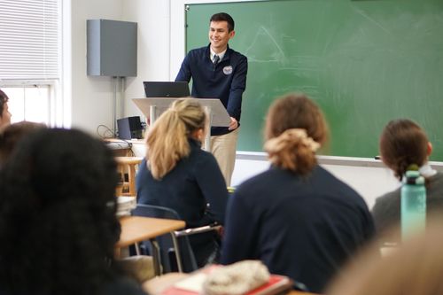 student speaking to class