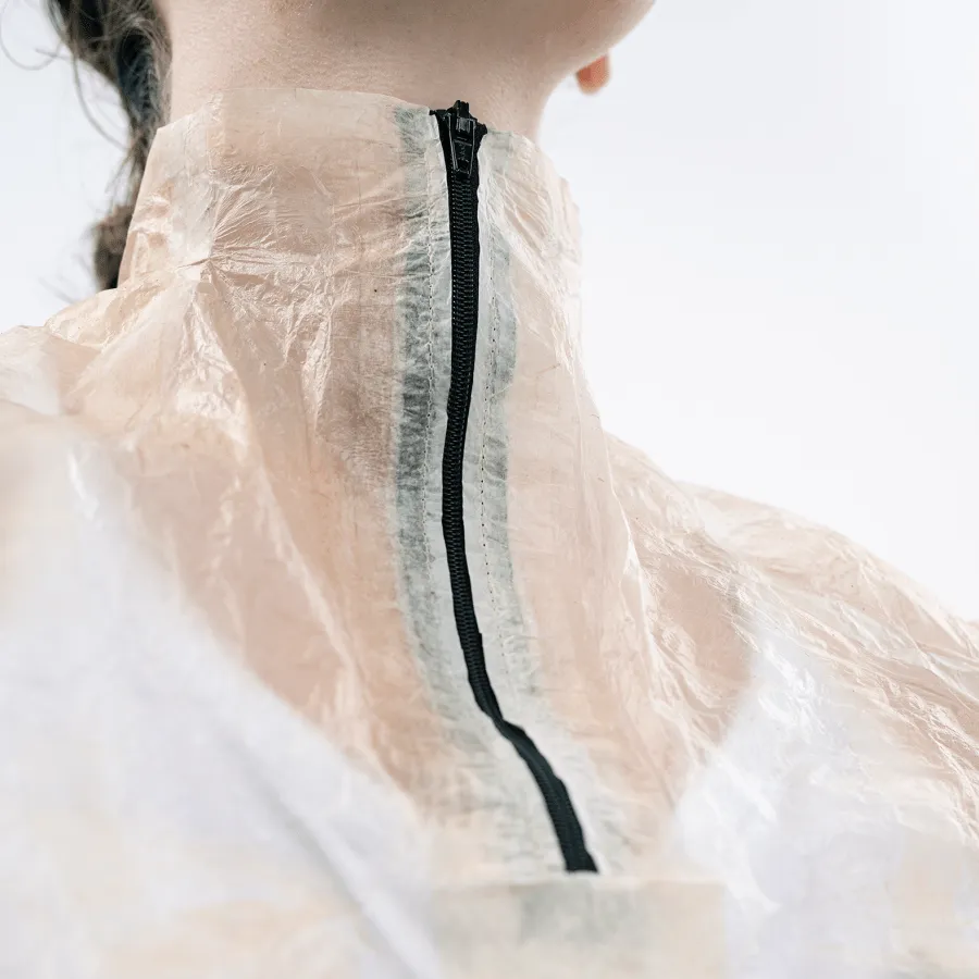 a black zipper on the collar within the translucent material of the jacket