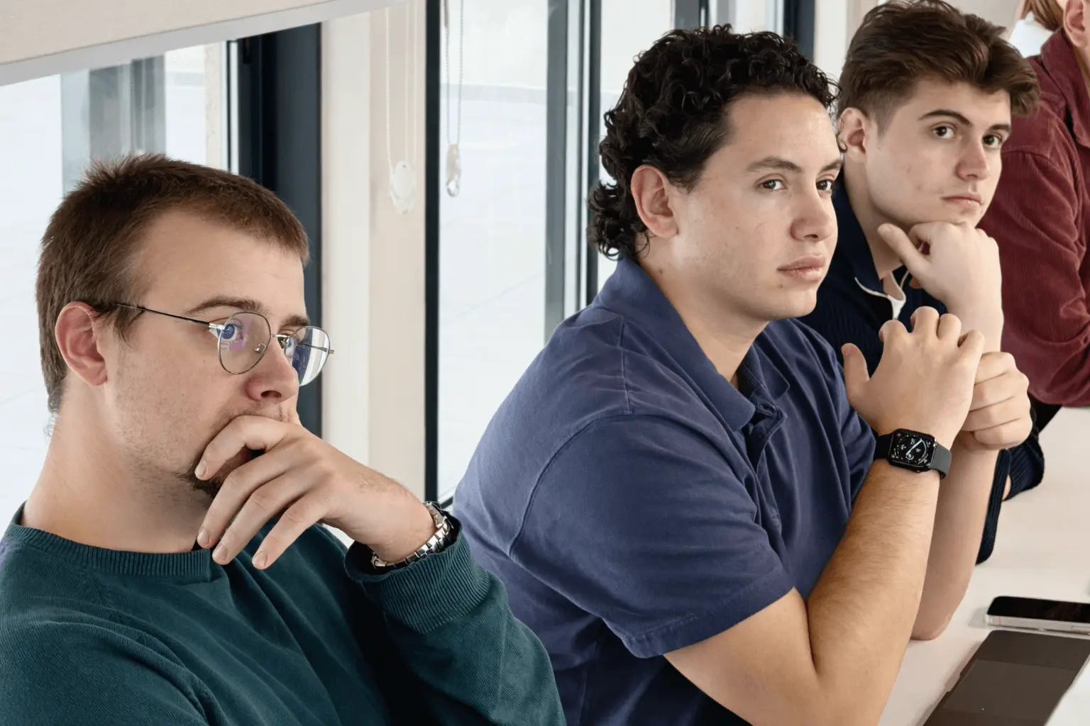 Next Talent 2 participants listening and discussing during a team presentation.