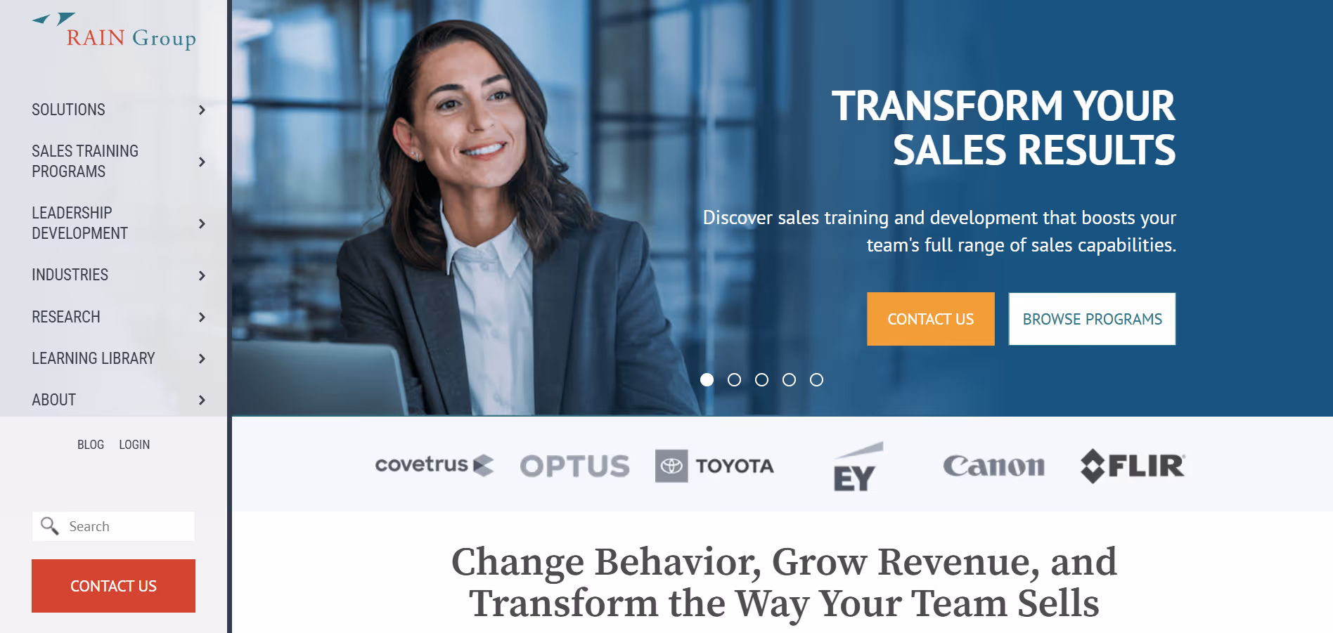 Rain group website screenshot with a hero section with a smiling businesswoman in a blazer working on a laptop with sales training program text and company logos nearby.