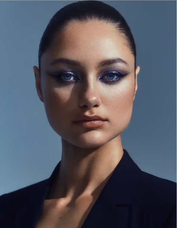 a woman with blue eyes and black hair