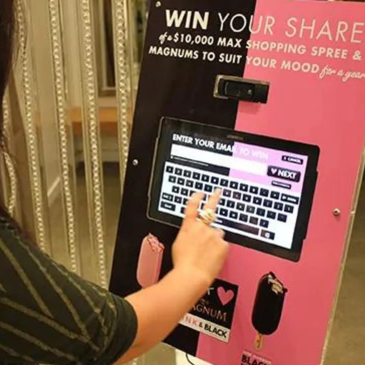 a woman is playing a game on a pink machine