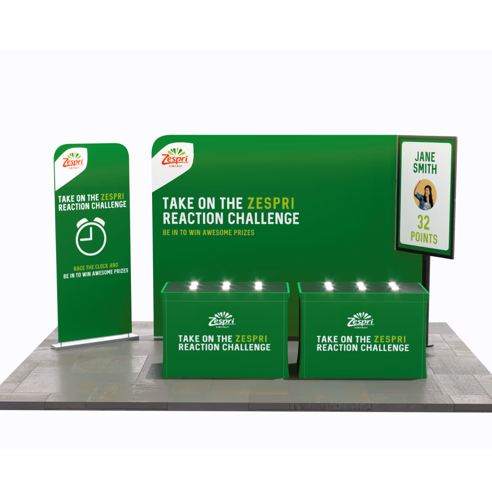 Zespri Reaction Challenge setup with green banners, tables, and a screen showing a player’s score.