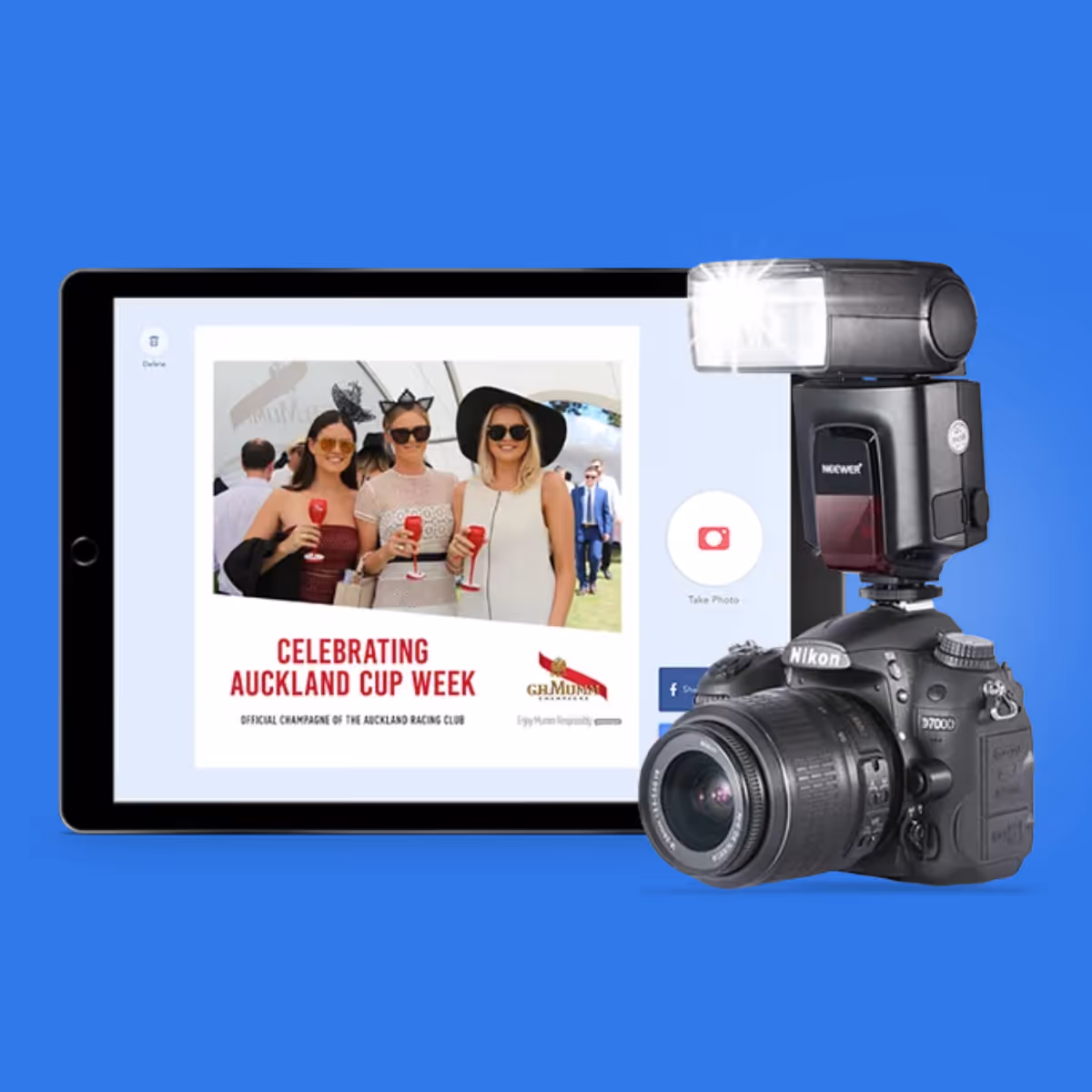 Nikon camera with flash next to tablet showing photo booth image from Auckland Cup Week event.