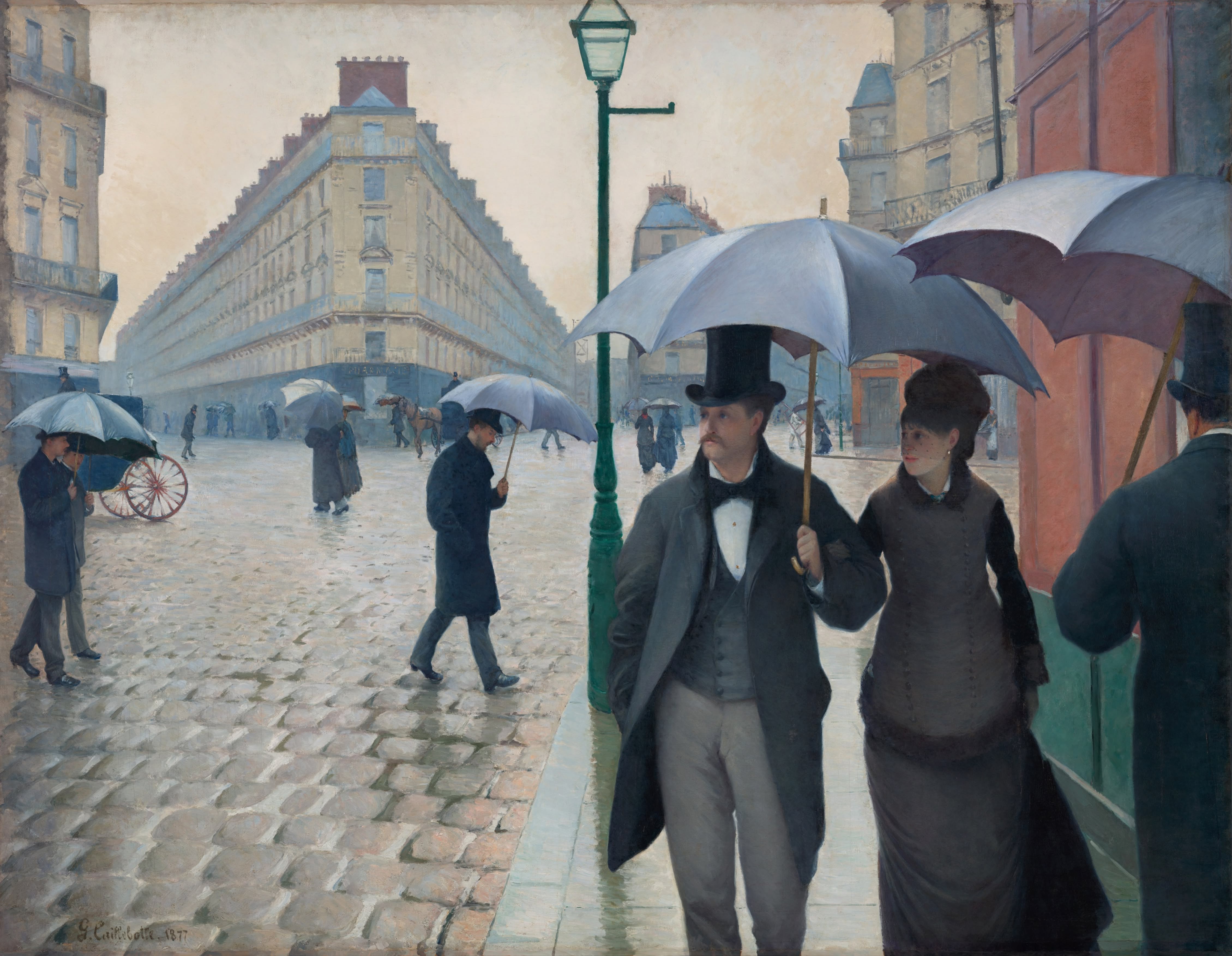 A painting by Gustave Caillebotte made in 1877 depicting a rainy Paris street with well-dressed pedestrians carrying umbrellas across wet cobblestones, with a couple walking in the foreground. Image courtesy The Art Institute of Chicago.