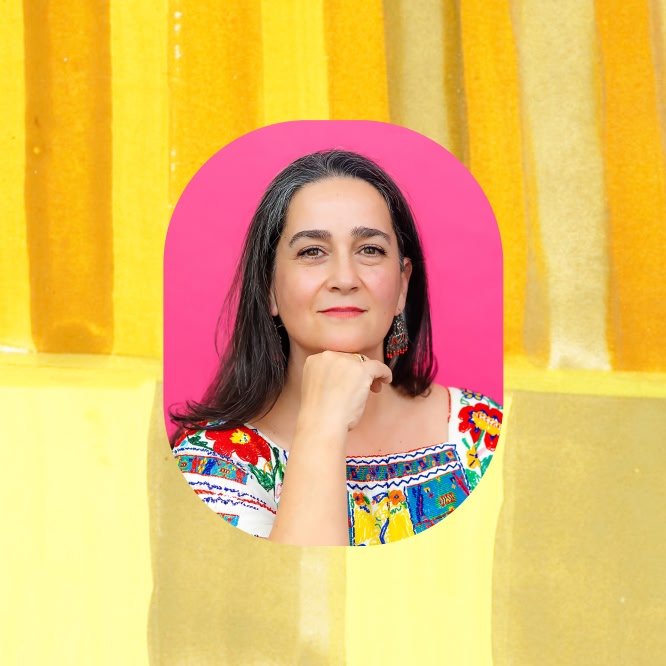 Artist Ana Bianchi rests her chin on her hand in a rounded portrait frame, wearing a colorful embroidered top against a bright pink backdrop. The portrait is centered over a yellow-orange striped background.