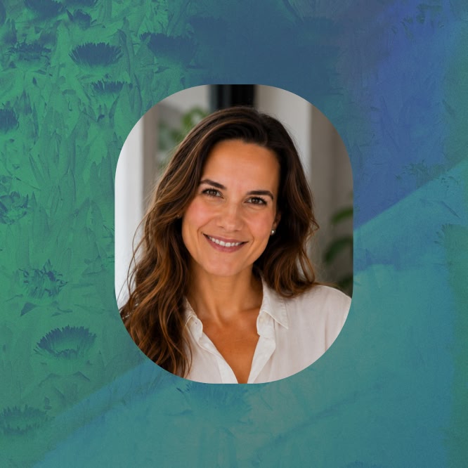 Dr. Anne-Kathrin Eiselt smiles at the camera in a white blouse, framed in an oval portrait against a textured blue-green background.