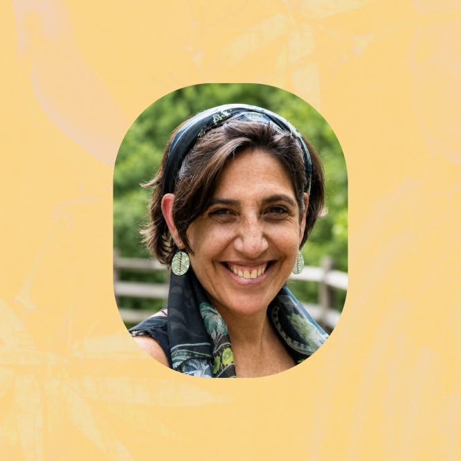 Portrait of Julia Schmidt smiling outdoors, framed in a rounded cutout against a soft yellow graphic background.