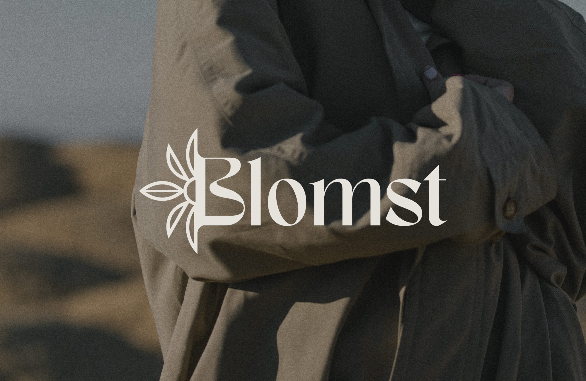 Blomst logo with woman standing in the background.