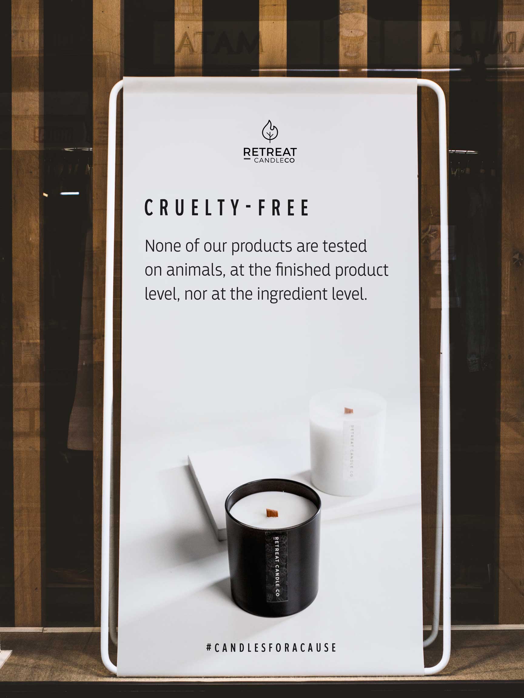 Roots poster for sustainability against a wooden beam wall 