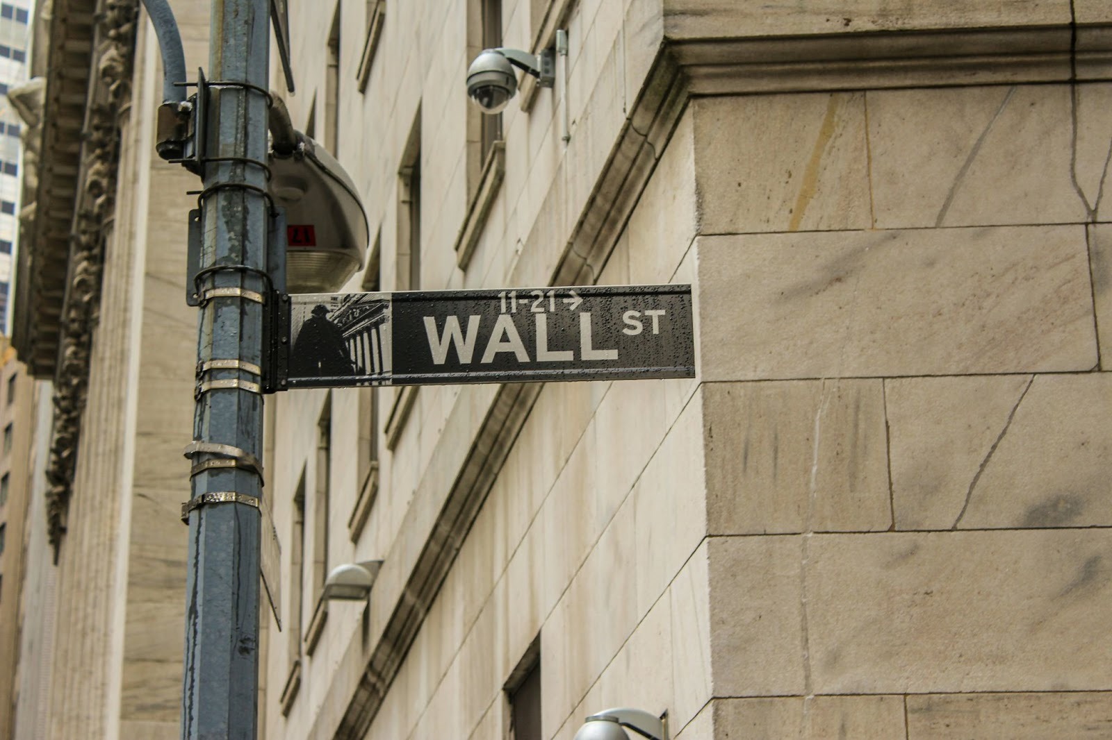 A Wall Street street sign signifies a company's IPO plans informed by Swarm AI.
