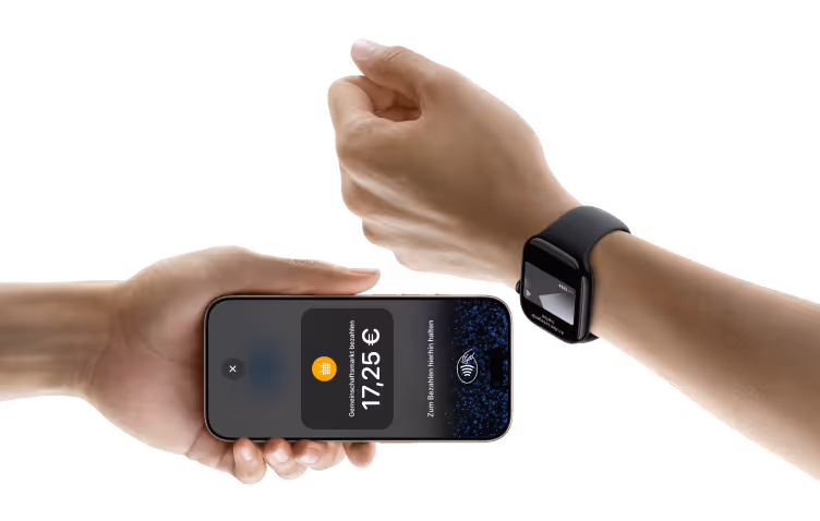 A hand holding a smartphone showing a payment confirmation of 17,25 euros being made to another hand wearing a smartwatch with a contactless payment symbol.