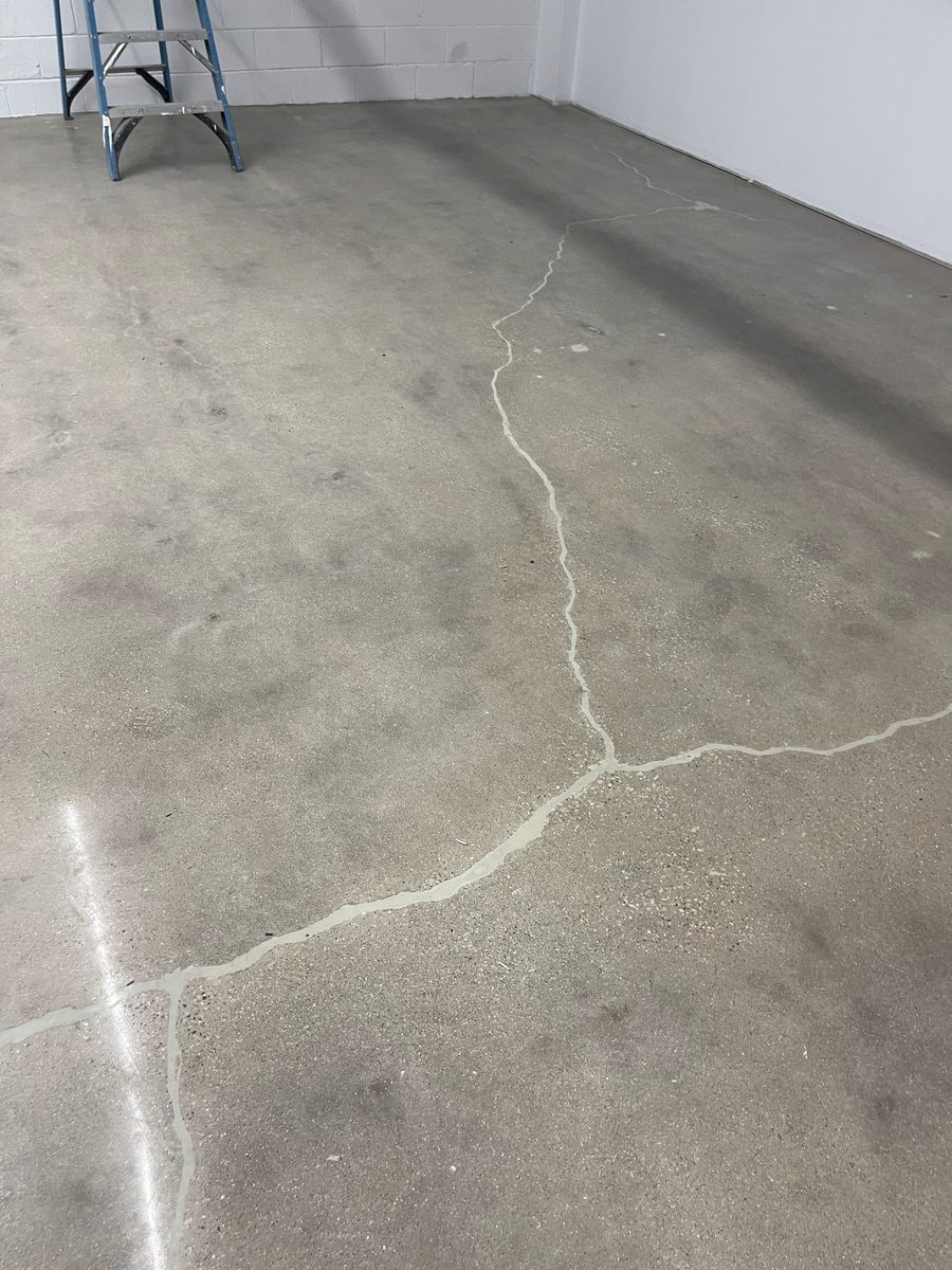 Concrete crack repair with epoxy filler before floor coating application — commercial facility substrate prep, PPD Painting project
