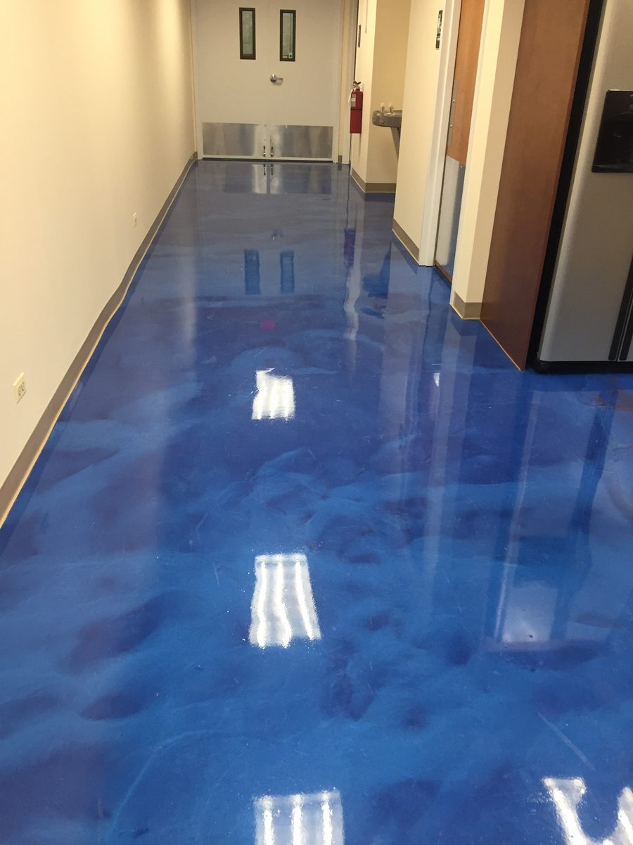 Metallic epoxy floor in commercial corridor — deep blue swirled metallic finish, PPD Painting project