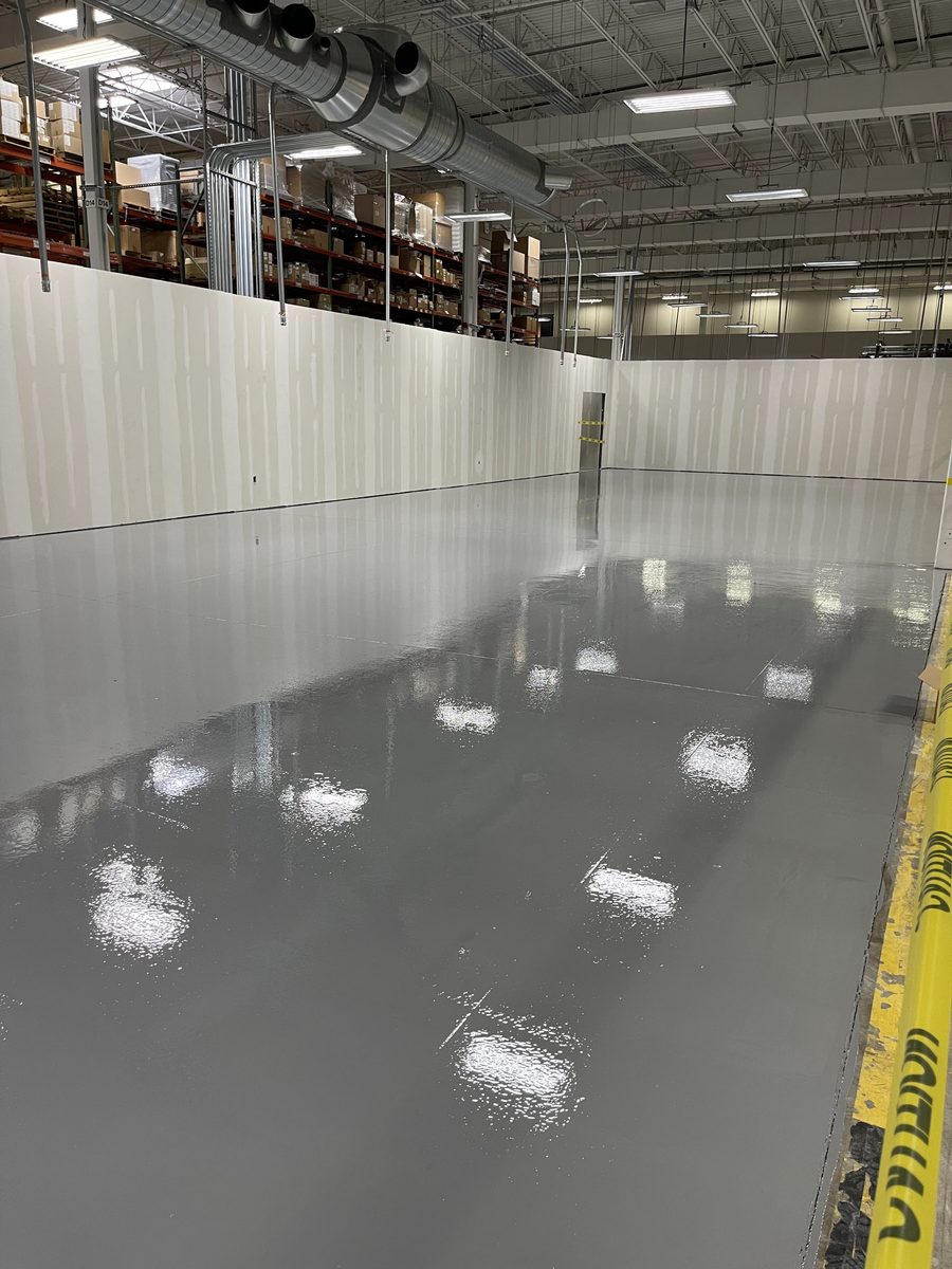 Solid color epoxy in an occupied warehouse — zero VOC, no shutdown required, PPD Painting project