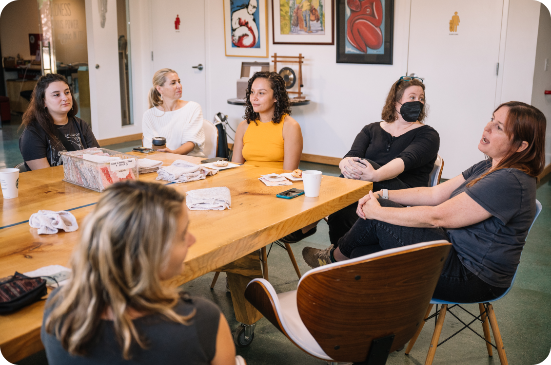 People conversing around a table