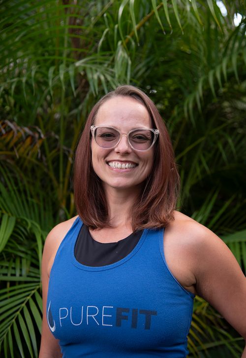 women in front of greenery