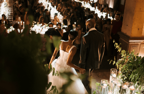 A lush celebration in a historic venue, where timeless architecture met vibrant greenery to create jungle-chic atmosphere.