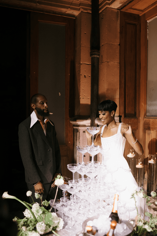A lush celebration in a historic venue, where timeless architecture met vibrant greenery to create jungle-chic atmosphere.