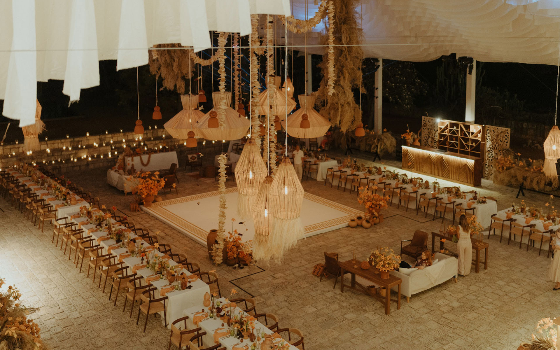 A nostalgic dream filled with warm orange hues and intimate details, bringing Sabrina and Rogelio's love story to life.