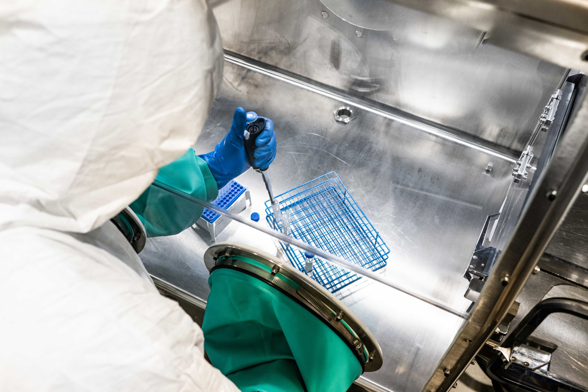 Shine Employee working in a hot cell.