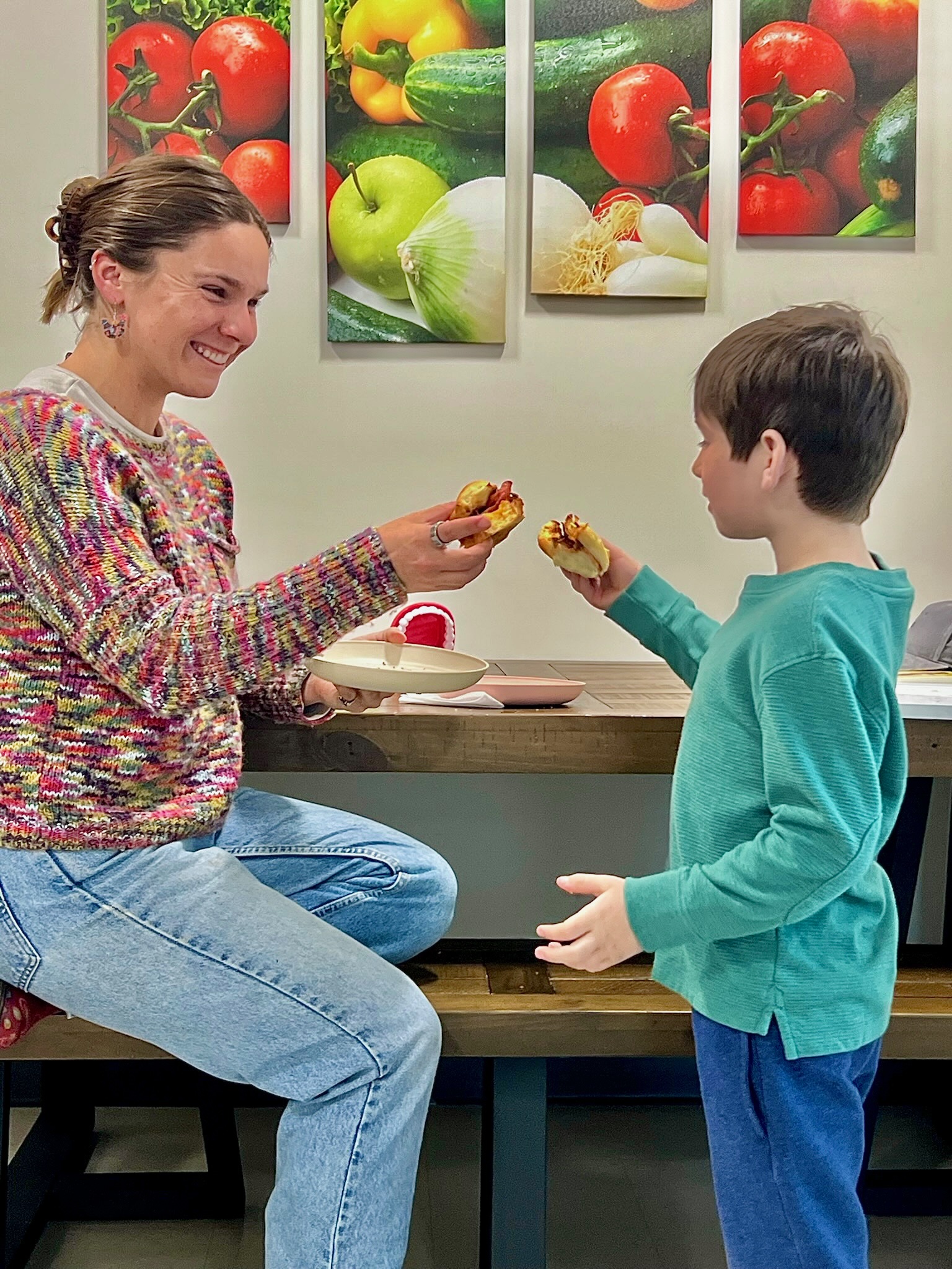 Speech-language pathologist engaging a young boy in a tabletop activity to support speech and language development at Speech-N-Motion in North County San Diego.