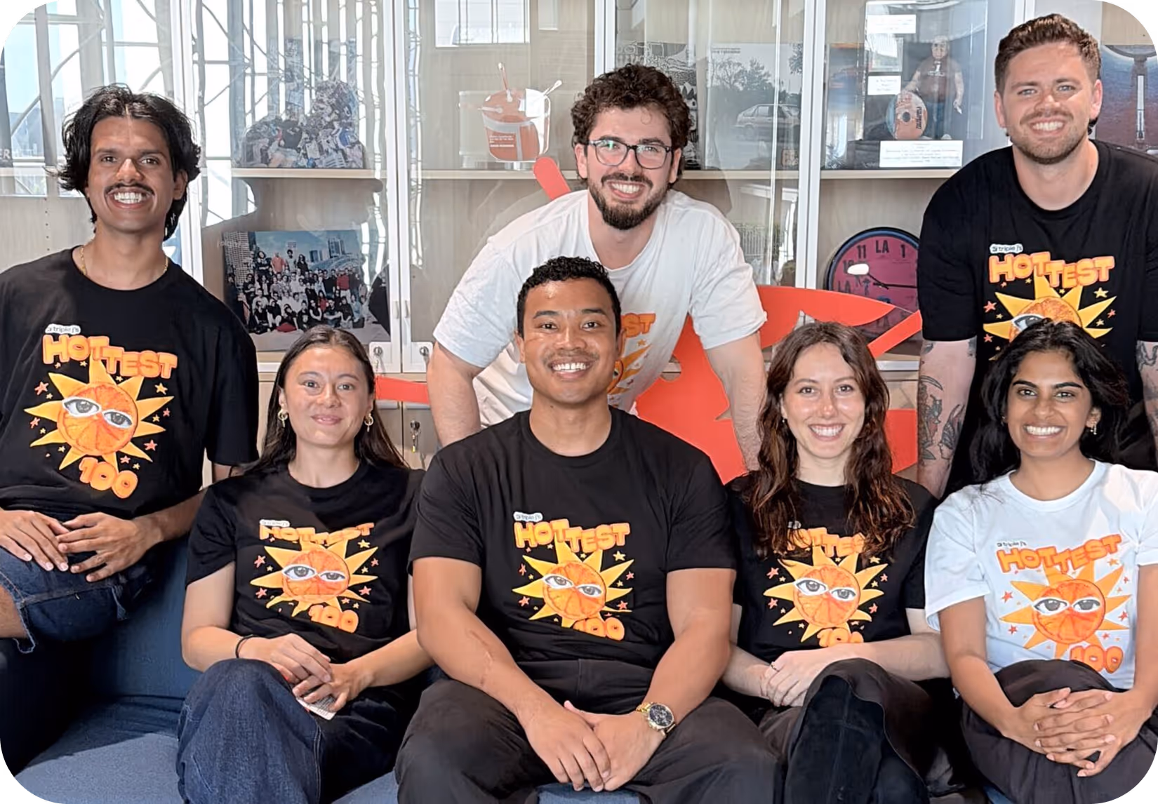 Sales and operations team sitting together in a modern office during a team meeting
