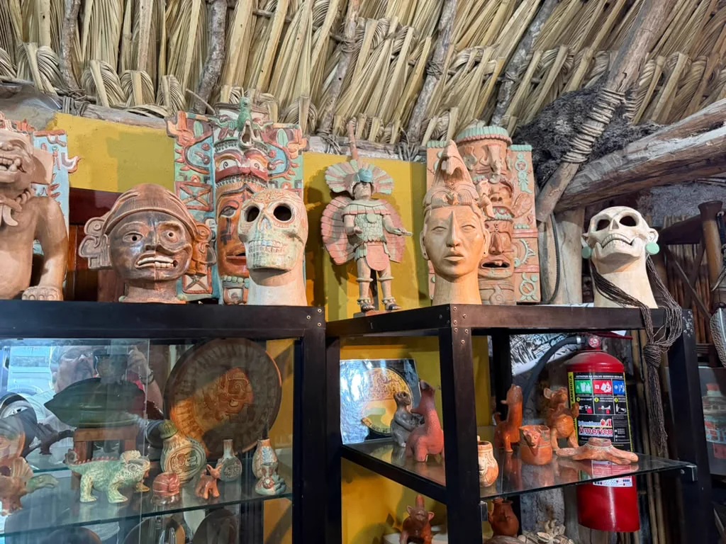Pre-Hispanic ceramic replicas displayed at Los Ceibos Arte Maya