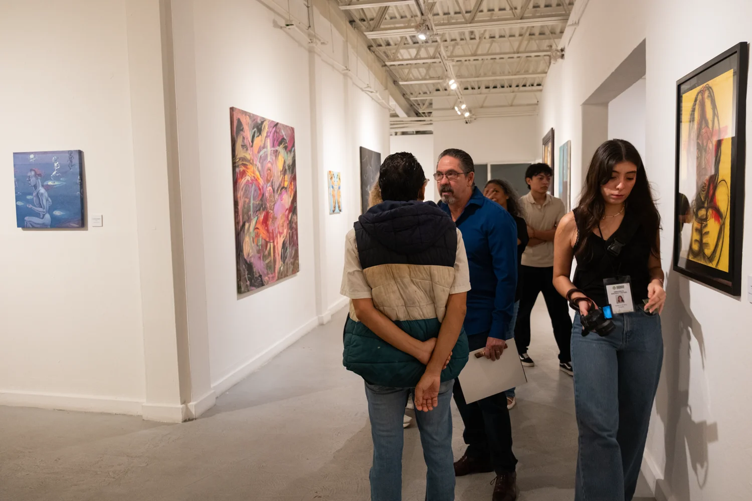 Visitors gather around a mixed-media installation